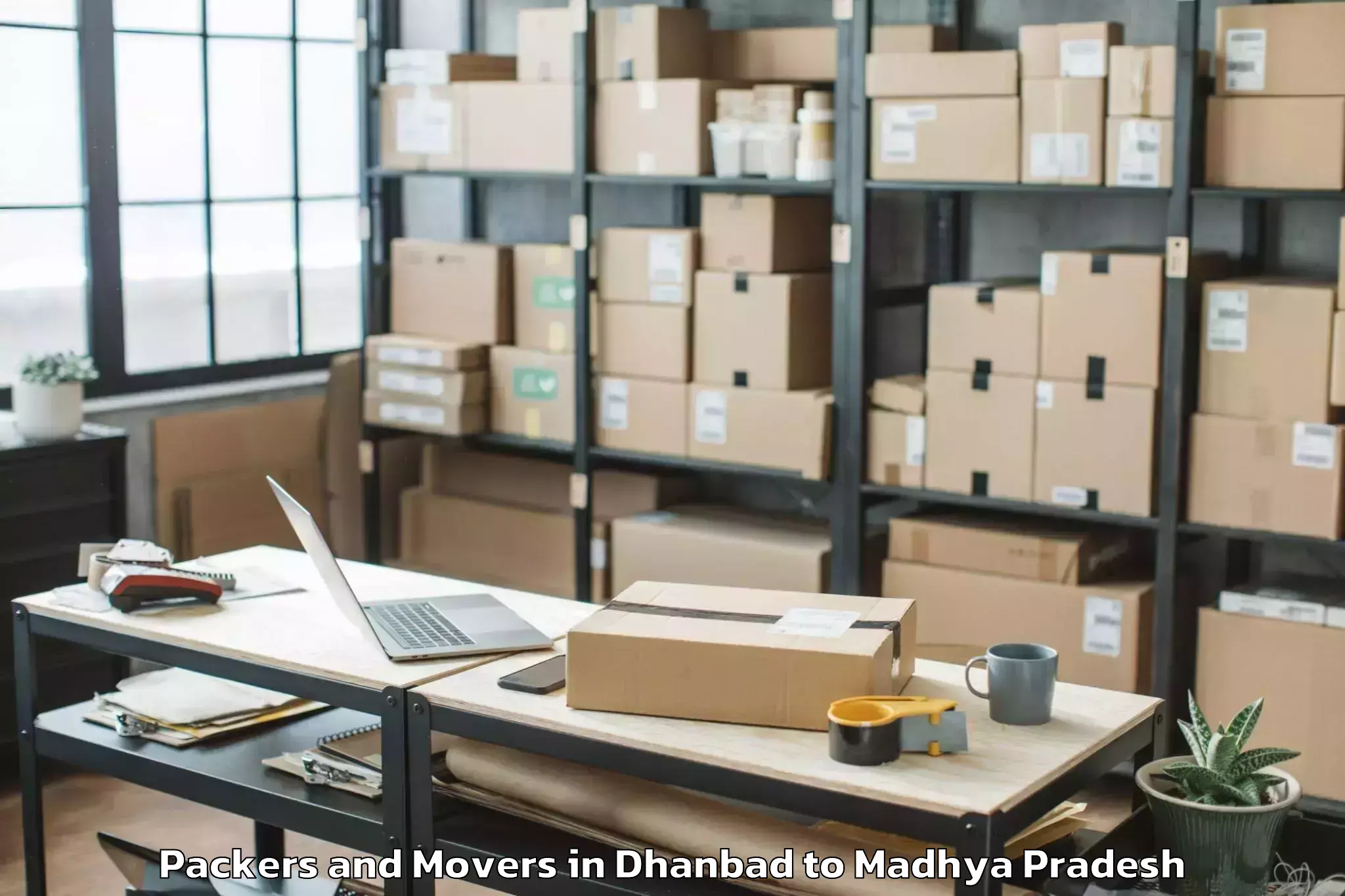 Reliable Dhanbad to Barnagar Packers And Movers